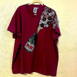 Queen Of Sparkles Poppin’ Champagne Tee
Burgundy/Maroon in color w/white.